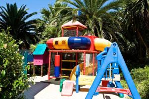 a colorful playground with a slide and a play structure at Residence Oltremare in San Benedetto del Tronto