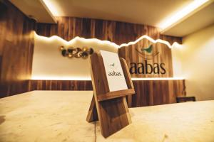 a table with a sign on top of a table at Aabas Pokhara by Barahi Hospitality in Pokhara