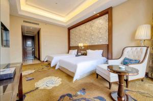 Ένα ή περισσότερα κρεβάτια σε δωμάτιο στο Days Hotel by Wyndham Logan City Huizhou