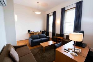 a living room with a couch and a table at Park Hotel in Mount Gambier
