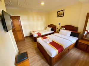 Llit o llits en una habitació de Hotel Bodhiz