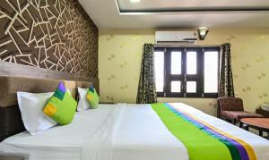 Ein Bett oder Betten in einem Zimmer der Unterkunft Treebo Siddharth