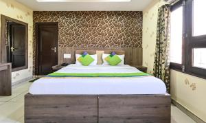 Ein Bett oder Betten in einem Zimmer der Unterkunft Treebo Siddharth