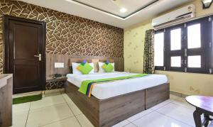 Ein Bett oder Betten in einem Zimmer der Unterkunft Treebo Siddharth