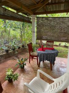 a patio with a table and two chairs at Thilina Homestay in Sigiriya