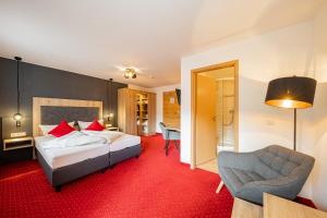Postel nebo postele na pokoji v ubytování Berghotel & Chalets Adersberg Chiemgau Card kostenfrei