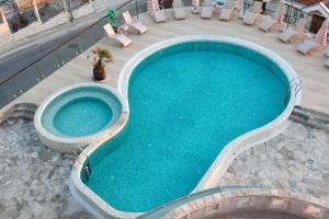 an overhead view of a swimming pool with chairs at Spa Resort Luxury Apartments in Budva