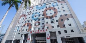 a building with a sign on the side of it at Phoenix Hotel Taichung in Taichung