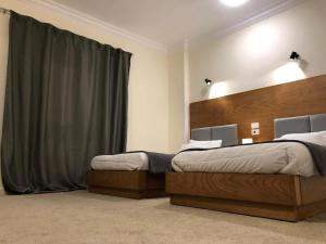 Katil atau katil-katil dalam bilik di Sphinx Luxor Apartment +31 gambar