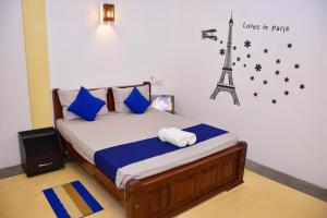 Letto o letti in una camera di Ocean Gate Villa Tangalle