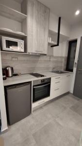 A kitchen or kitchenette at Anastasia Boutique Suites -Adults only & kids 12 plus