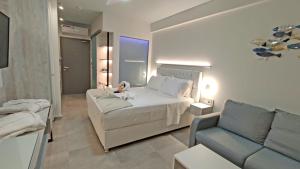 A bed or beds in a room at Anastasia Boutique Suites -Adults only & kids 12 plus