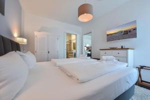Katil atau katil-katil dalam bilik di Villa Westend - Wohnung 14