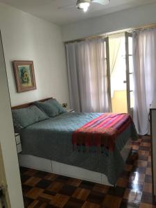 Cama o camas de una habitación en Apartamento em Copacabana
