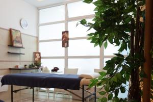 a room with a bed and a large window at Spa Resort Luxury Apartments in Budva
