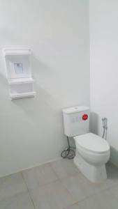 a bathroom with a toilet in a white room at SuanMalisamuiVilla G01 in Koh Samui