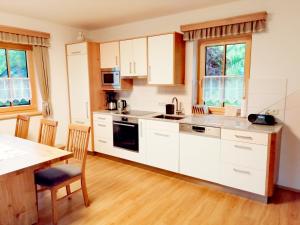 Kuchyň nebo kuchyňský kout v ubytování Ferienhaus Penitz + 31 fotografií