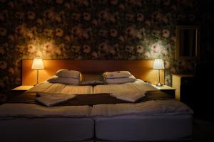 Posteľ alebo postele v izbe v ubytovaní Lugas Hotel