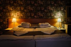 Posteľ alebo postele v izbe v ubytovaní Lugas Hotel