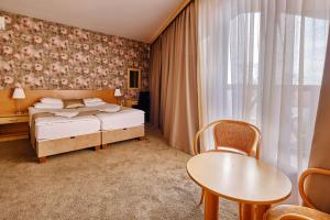 Posteľ alebo postele v izbe v ubytovaní Lugas Hotel + 31 fotografií