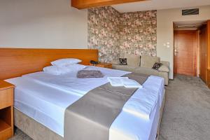 Posteľ alebo postele v izbe v ubytovaní Lugas Hotel