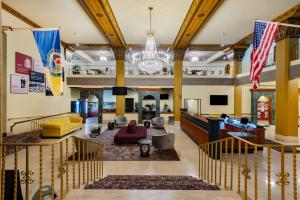 a large living room with a chandelier in a building at The Americus Hotel, Trademark Collection by Wyndham in Allentown