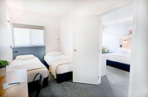 A bed or beds in a room at City Centre Motel Armidale