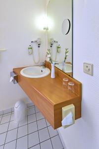 Koupelna v ubytování HESSE HOTEL Celle + 17 fotografií