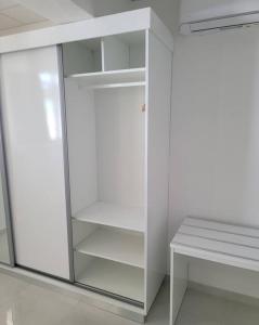 a white refrigerator with its door open in a room at Hello Guyane(3), Suite Prestige Premium, 5 étoiles in Cayenne