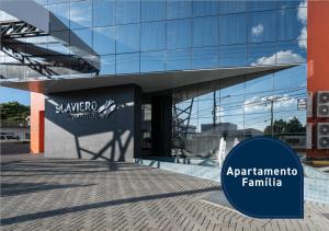 a building with a sign in front of it at Slaviero Chapecó in Chapecó