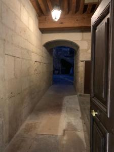 an empty hallway in a building with a light on the ceiling at Les Tiercelines in Dole
