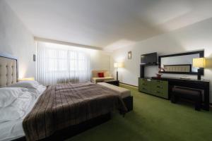Łóżko lub łóżka w pokoju w obiekcie Hotel Astory Plzeň