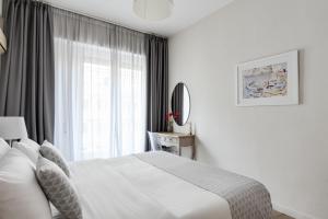 Posteľ alebo postele v izbe v ubytovaní Syntagma Spotlight Residence