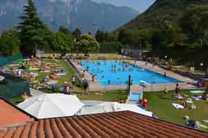 a large group of people in a swimming pool at Casa Teodoro - Gelsomino, Ulivi & Orchidea in Tignale