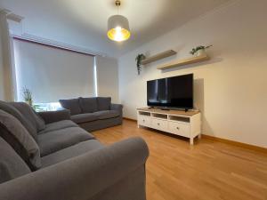 A television and/or entertainment centre at OKTHEWAY Castelao Street