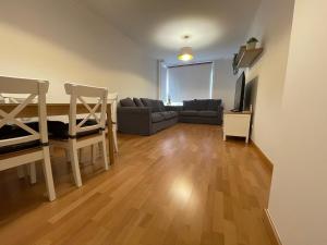 A seating area at OKTHEWAY Castelao Street