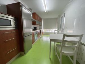 A kitchen or kitchenette at OKTHEWAY Castelao Street