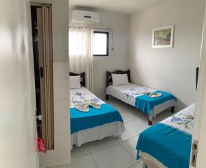 En eller flere senge i et værelse på Hotel Mirante B