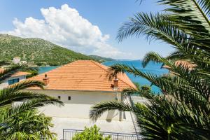 a house with a view of the water at Apartments Bilaja in Marina