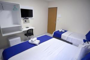 Postel nebo postele na pokoji v ubytování Pousada Costera