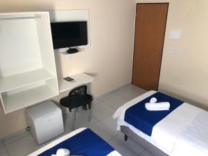 Postel nebo postele na pokoji v ubytování Pousada Costera