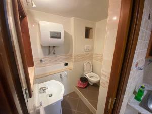 a small bathroom with a toilet and a sink at Casa Asia in Vieste