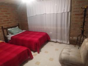 Ein Bett oder Betten in einem Zimmer der Unterkunft Casa de Campo El Cabañal - San José De Minas