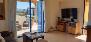TV a/nebo společenská místnost v ubytování Penthouse direkt am Meer