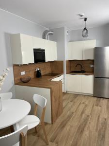 Kuchyň nebo kuchyňský kout v ubytování Apartament Kołobrzeg Kasprowicza