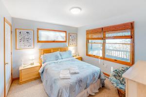 a bedroom with a bed and a window at The Treehouse #2-BB in Buxton