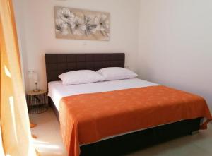 Posteľ alebo postele v izbe v ubytovaní Apartament Wioletta Ciovo Okrug Gornji + 29 fotografií