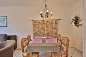 a dining room with a table and chairs at Strandschlößchen Strandschlösschen Appartement 3 in Haffkrug