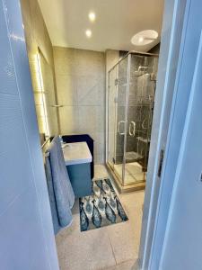 a bathroom with a shower and a sink at Sea View Paradise in Alexandria +58 photos