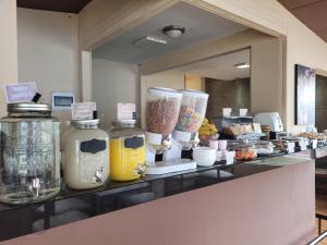 a counter with some jars of food on it at Hotel Monte Carlo in La Paz